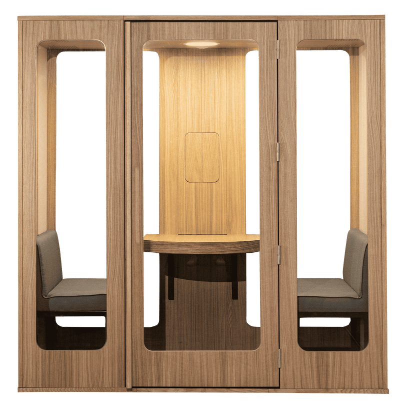 Haven Four meeting pod featuring a modern wooden enclosure with two built-in seats and a central table, showcasing natural oak finish and minimalist design with soundproof walls for intimate workplace conversations and collaborative sessions.